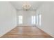 Bright living room with modern chandelier and multiple windows at 165 Cedarwood Ln, Roswell, GA 30075