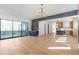 Open-concept living room with deck access, custom cabinets, and seamless kitchen flow at 165 Cedarwood Ln, Roswell, GA 30075