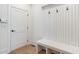 The mud room has storage, a bench, and a sleek door, blending style and function at 165 Cedarwood Ln, Roswell, GA 30075