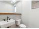 Modern powder room featuring designer fixtures and stylish tile work at 165 Cedarwood Ln, Roswell, GA 30075