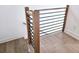 Modern staircase with wood and black metal railing at 165 Cedarwood Ln, Roswell, GA 30075