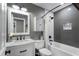 The bathroom is equipped with modern vanity, fixtures and shower-over-tub configuration at 2447 Tift Nw Ct, Kennesaw, GA 30152