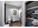 Bathroom features modern vanity, walk-in shower and organized shelving at 2447 Tift Nw Ct, Kennesaw, GA 30152