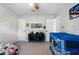 bedroom with carpet floor, dinosaur decor, and two white doors at 2447 Tift Nw Ct, Kennesaw, GA 30152