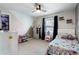 Charming bedroom with carpeted floor, a ceiling fan, and a window with a view of the outside at 2447 Tift Nw Ct, Kennesaw, GA 30152