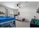 bedroom with carpet floors, single bed, and dinosaur decor at 2447 Tift Nw Ct, Kennesaw, GA 30152