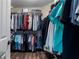 Walk-in closet featuring clothing racks and laminate wood floors at 2447 Tift Nw Ct, Kennesaw, GA 30152