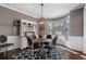 Elegant dining room with gray walls, a wood table set, and a bright bay window at 2447 Tift Nw Ct, Kennesaw, GA 30152