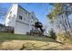 Exterior of home with multilevel decks overlooking spacious lawn and treelined backyard at 2447 Tift Nw Ct, Kennesaw, GA 30152