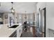 Bright kitchen showcasing modern appliances, white cabinetry, and a cozy breakfast nook at 2447 Tift Nw Ct, Kennesaw, GA 30152