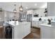 Bright, modern kitchen with white cabinetry, stainless steel appliances, and a marble countertop island at 2447 Tift Nw Ct, Kennesaw, GA 30152