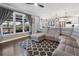 Open-concept living room featuring plush seating, a scenic view, and access to the outdoors at 2447 Tift Nw Ct, Kennesaw, GA 30152
