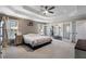 Large main bedroom featuring a trey ceiling, carpet floors, and closet access through french doors at 2447 Tift Nw Ct, Kennesaw, GA 30152