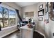 Bright home office with a large window, custom desk, and ample natural light, perfect for remote work at 2447 Tift Nw Ct, Kennesaw, GA 30152