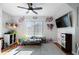 Bright playroom featuring hardwood floors, ceiling fan and lots of natural light from the window at 2447 Tift Nw Ct, Kennesaw, GA 30152