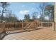 Spacious wooden back deck featuring wooden railings, perfect for outdoor entertaining and relaxing under the sky at 2916 Kings Walk Ave, Marietta, GA 30062