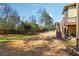Spacious backyard featuring tiered deck, privacy fence, and mature landscaping at 2916 Kings Walk Ave, Marietta, GA 30062