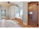 Bathroom featuring a glass shower, soaking tub, tiled floor and accent window at 2916 Kings Walk Ave, Marietta, GA 30062
