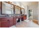 Bathroom with dual sink vanity, granite counters, decorative mirrors, and tile flooring at 2916 Kings Walk Ave, Marietta, GA 30062