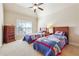 Bedroom with vaulted ceilings, large windows and two beds with rocket-themed decor at 2916 Kings Walk Ave, Marietta, GA 30062