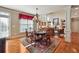 Bright dining area with hardwood floors and natural light, seamlessly flowing into the living space at 2916 Kings Walk Ave, Marietta, GA 30062