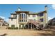 Backyard elevation of home featuring tiered deck, multiple windows, and backyard at 2916 Kings Walk Ave, Marietta, GA 30062