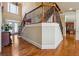 Spacious foyer with hardwood floors, staircase with decorative railings, and view of the entrance and kitchen at 2916 Kings Walk Ave, Marietta, GA 30062