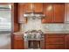 Gourmet kitchen with stainless steel range, custom cabinets, and granite countertops at 2916 Kings Walk Ave, Marietta, GA 30062