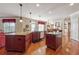 Bright and airy kitchen with wooden floors, kitchen island, and seamless transition to dining area at 2916 Kings Walk Ave, Marietta, GA 30062
