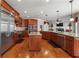 Spacious kitchen with stainless steel appliances, granite countertops, and cherry wood cabinetry at 2916 Kings Walk Ave, Marietta, GA 30062