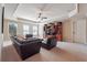 Spacious living room with tray ceilings, ceiling fan, and plush seating arrangement at 2916 Kings Walk Ave, Marietta, GA 30062
