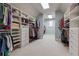 Large walk-in closet with custom shelving and ample storage for clothing at 2916 Kings Walk Ave, Marietta, GA 30062