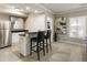 Finished basement with a bar, seating, and an abstract artwork at 4235 Iron Duke Ct, Peachtree Corners, GA 30097