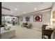 Spacious basement living area with athletic artwork, chairs, and gym access at 4235 Iron Duke Ct, Peachtree Corners, GA 30097
