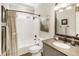 Clean bathroom with a shower-tub combo, modern fixtures, and ample counter space at 4235 Iron Duke Ct, Peachtree Corners, GA 30097