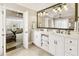 Bright main bathroom with double sinks, white cabinetry, and soaking tub at 4235 Iron Duke Ct, Peachtree Corners, GA 30097