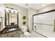 Well-lit bathroom featuring granite countertops and a shower/tub combo at 4235 Iron Duke Ct, Peachtree Corners, GA 30097