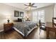 Bedroom with a large window, desk, and wood flooring at 4235 Iron Duke Ct, Peachtree Corners, GA 30097