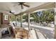 Covered patio with elegant outdoor seating, an outdoor dining area, and a tranquil view of the pool at 4235 Iron Duke Ct, Peachtree Corners, GA 30097