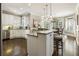 Charming kitchen with white cabinetry, granite countertops, and stainless steel appliances, flowing into a sunny breakfast nook at 4235 Iron Duke Ct, Peachtree Corners, GA 30097