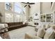Spacious living room with fireplace, built-in shelves and large windows at 4235 Iron Duke Ct, Peachtree Corners, GA 30097