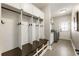 Well-organized mud room with built-in storage and a convenient laundry area for easy cleanup at 4235 Iron Duke Ct, Peachtree Corners, GA 30097