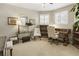 Well-lit home office with a desk, chair, and shelving at 4235 Iron Duke Ct, Peachtree Corners, GA 30097