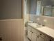 Functional bathroom with standard-sized sink and white tiled wall at 2374 Woodcastle Se Ln, Atlanta, GA 30316