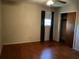 Bedroom featuring hardwood floors, a ceiling fan, window, and closet at 2374 Woodcastle Se Ln, Atlanta, GA 30316