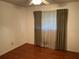 Bedroom featuring hardwood floors, a ceiling fan, and natural light at 2374 Woodcastle Se Ln, Atlanta, GA 30316