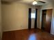 Bedroom featuring hardwood floors, a ceiling fan, window, and closet at 2374 Woodcastle Se Ln, Atlanta, GA 30316