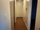 Long hallway with beautiful wood flooring and neutral-colored walls at 2374 Woodcastle Se Ln, Atlanta, GA 30316