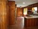 A vintage kitchen featuring wood paneling, laminate countertops, and ample natural light at 2374 Woodcastle Se Ln, Atlanta, GA 30316