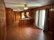 Vintage eat-in kitchen with wood paneling and floors, stainless appliances, and laminate countertops at 2374 Woodcastle Se Ln, Atlanta, GA 30316